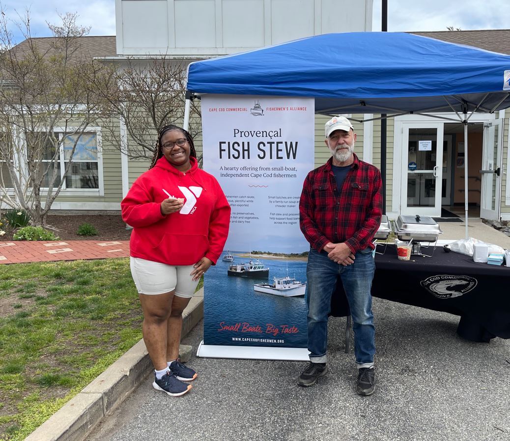 Tianna Bennett, YMCA staff, and Seth Rolbein of the Fishermen's Alliance, served up Haddock Chowder and Provencal Fish Stew at the YMCA's Family Fund Day. 